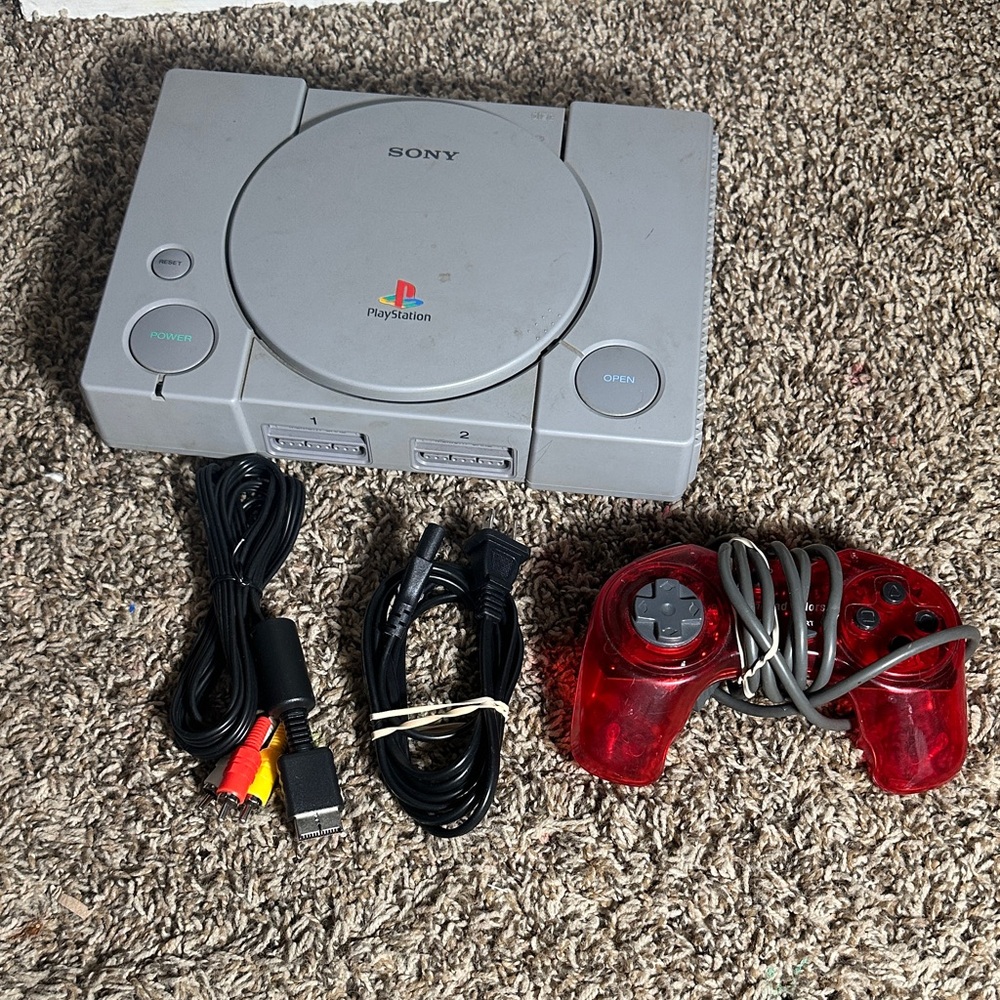 Sony PlayStation Console with Translucent Red Controller